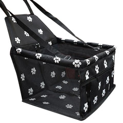 Black pet carrier with white paw prints on a white background